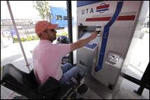 image of person in wheelchair using ticket kiosk